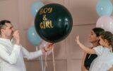 Expectant parents are having a gender reveal party, pink confetti.