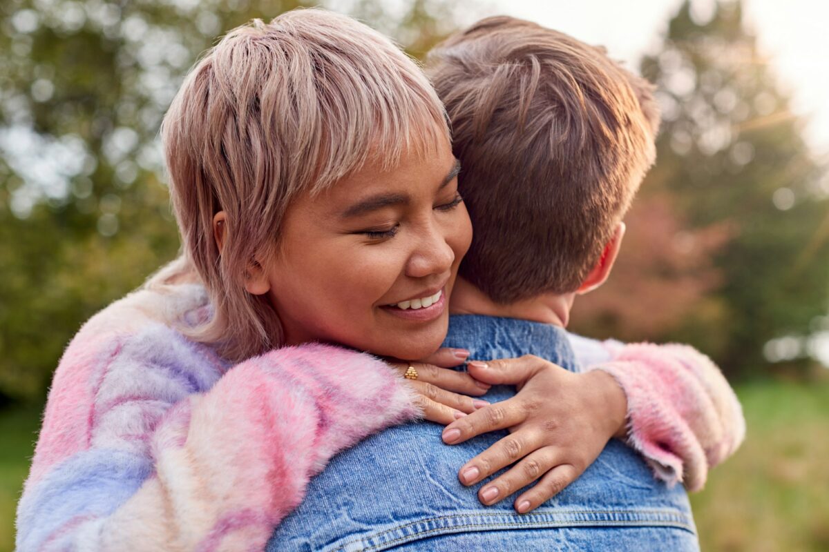 Loving Couple Outdoors In Countryside Laughing And Hugging