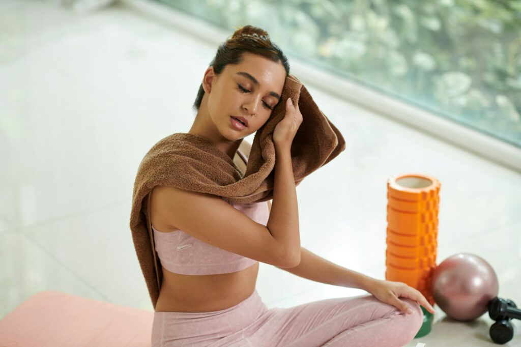 Tired Woman Wiping off Sweat
