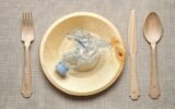 Eating plastic concept with table setting