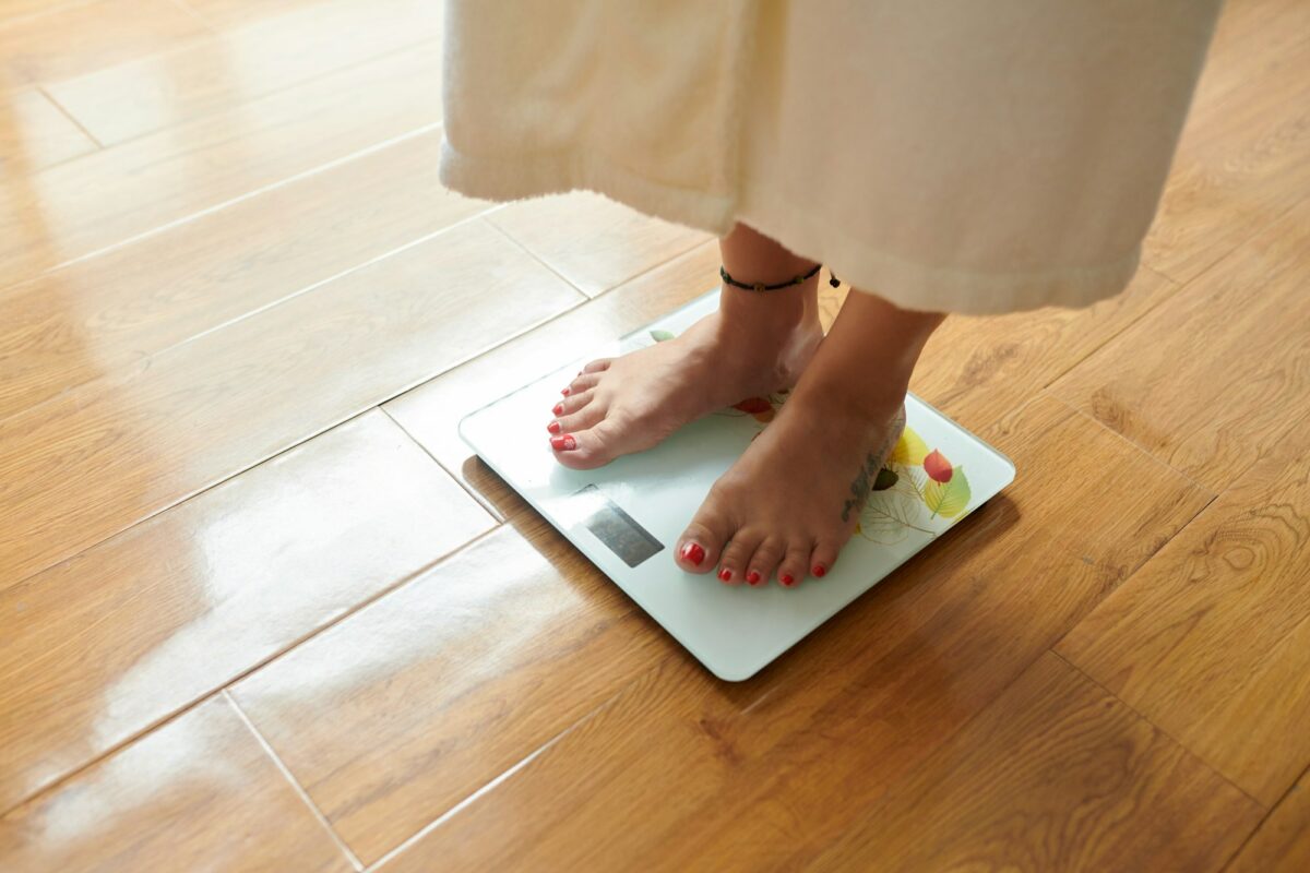 Checking body weight on digital scale